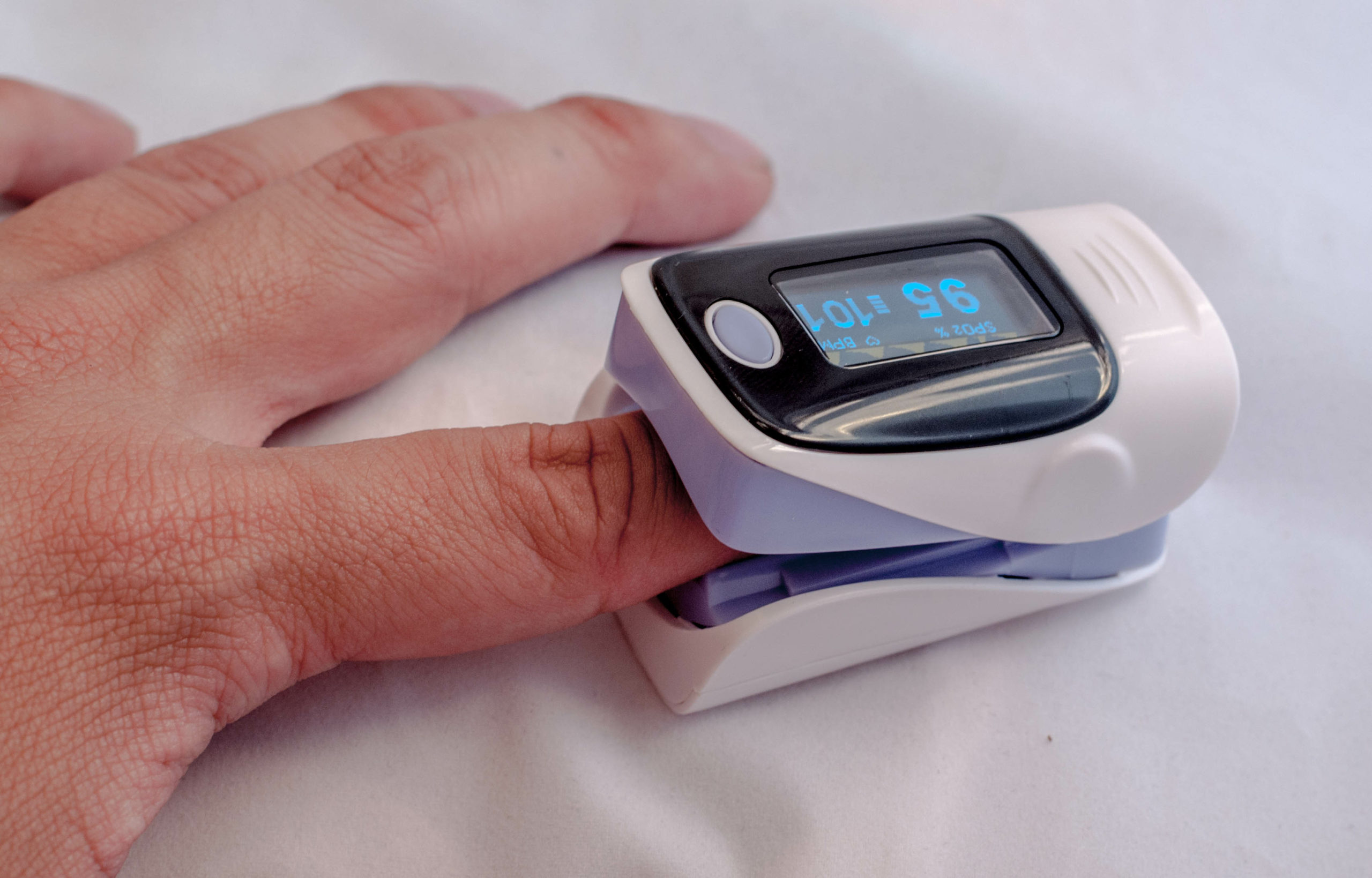 Pulse oximeter on the patient's hand